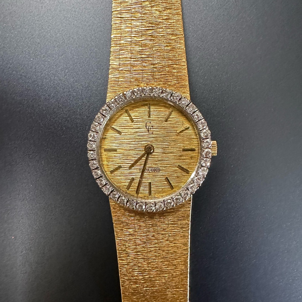 Vintage Gold 18k Watch w/diamond cluster bezel face.  Excellent condition.